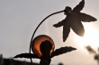 Kupferne Blume mit Orangenorb